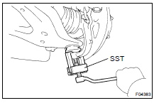 DISCONNECT STEERING KNUCKLE FROM LOWER SUSPENSION ARM