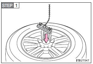 Stowing the flat/spare tire, jack and tools