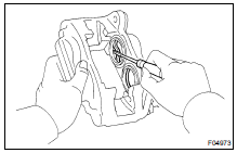 REMOVE PISTON SEALS FROM BRAKE CYLINDER