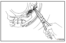 REMOVE TENSION SPRING