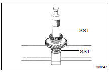Using SST and a press, install the clutch hub.