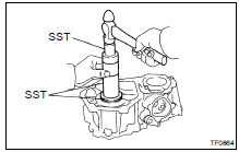(a) Using SST and a hammer, drive out the oil seal.