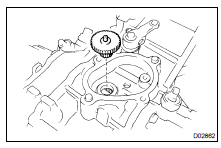 REMOVE OUTPUT GEAR FROM FRONT CASE