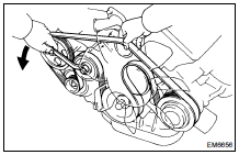 Loosen the drive belt tension by turning the drive belt tensioner