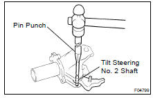 REMOVE TILT STEERING PAWL