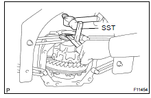 (c) Using SST and a hammer, remove the 2 side bearing