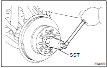 (b) Using SST, torque the lock nut.