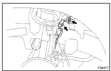 Remove the 2 bolts and disconnect the ABS speed sensor wire