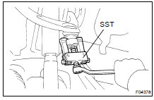(c) Using SST, disconnect the steering knuckle from the upper