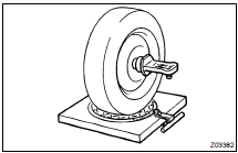 INSTALL CAMBER-CASTER-KINGPIN GAUGE OR POSITION VEHICLE ON WHEEL ALIGNMENT TESTER