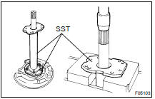 (c) Position SST on the backing plate with the 4 nuts.