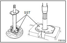 REMOVE AXLE SHAFT FROM BACKING PLATE