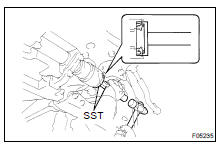 (c) Using SST and a hammer, install the new oil seal.