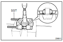  REMOVE DRIVE PINION REAR BEARING