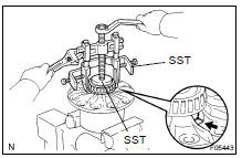 Using SST, remove the side bearing.