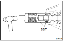 Using SST and a hammer, install the bearing outer race.
