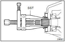 REMOVE OIL SEAL AND OIL SLINGER