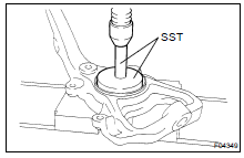 (a) Using SST and a press, install a new oil seal.