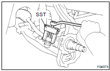 (b) Using SST, disconnect the tie rod end from the steering