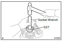 (b) Using SST and a hammer, tap out the bearing.