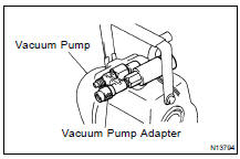 (a) Connect the vacuum pump adapter to the vacuum pump.
