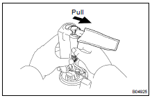 (a) Pull out the lower side of the fuel pump from the pump