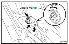 PLACE THERMOSTAT IN WATER INLET HOUSING