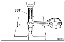 (a) Using SST and a press, press out the bushing.