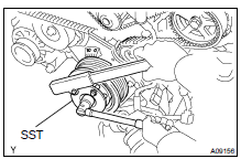 LOOSEN CRANKSHAFT PULLEY BOLT