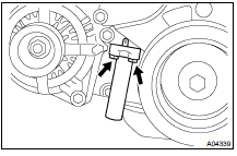 Alternately loosen the 2 bolts, and remove the belt tensioner