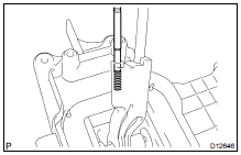 (a) Using a magnetic finger, remove the detent shift lever pin