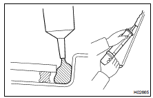 APPLY ADHESIVE TO MOULDING INSTALLATION AREA