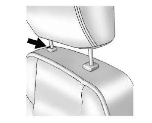 To lower the head restraint, press